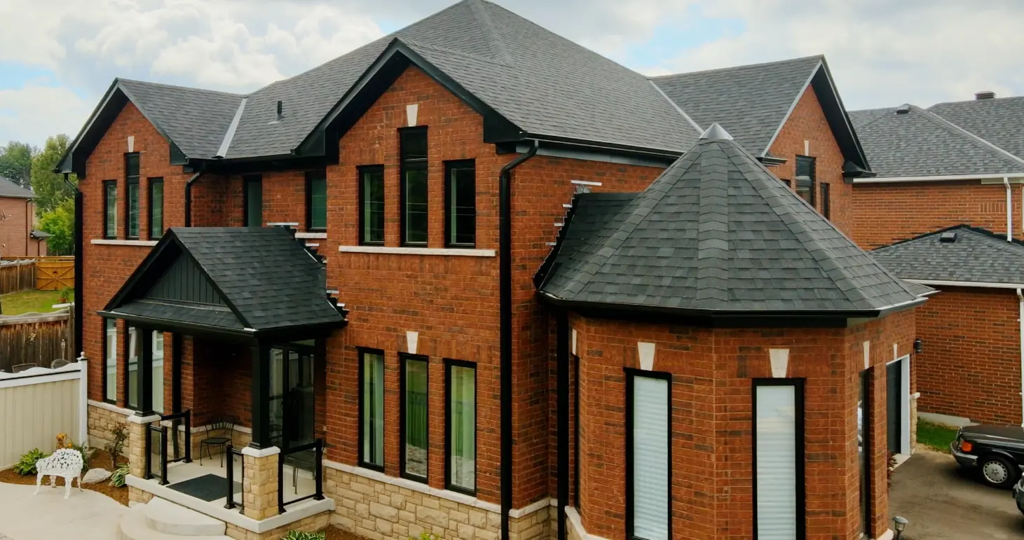 A brick home with a new roof