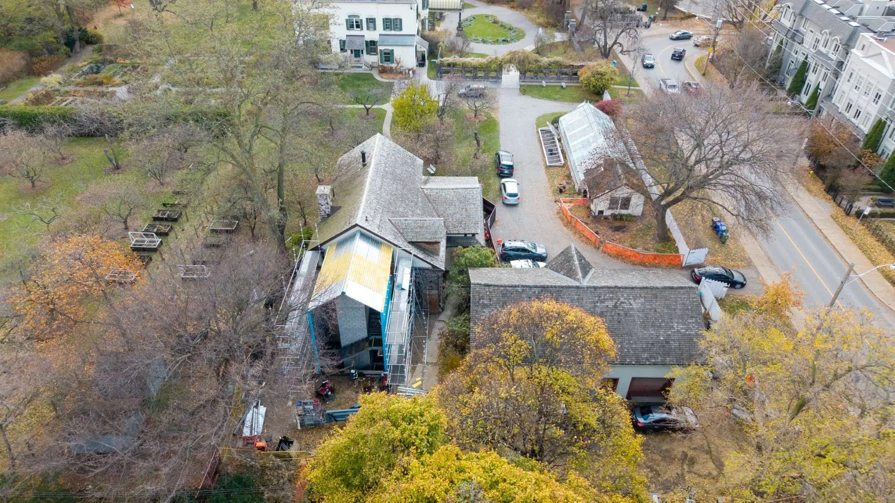 Aerial view of the Spadina Museum restoration with scaffolding and new zinc roofing