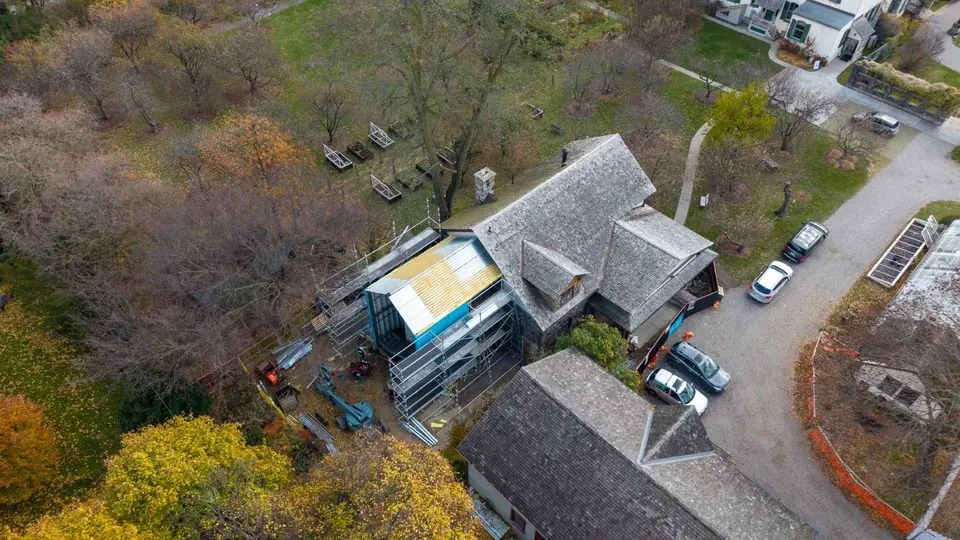 Aerial of the museum wing wrapped for installation in autumn